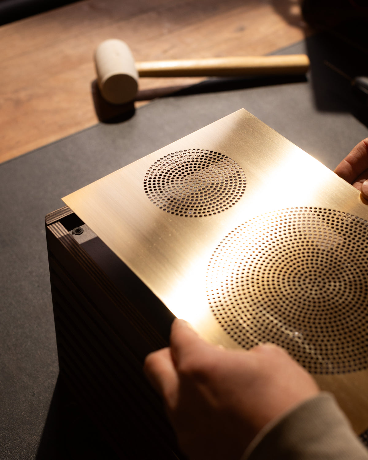 Drilling the raw brass grille by hand