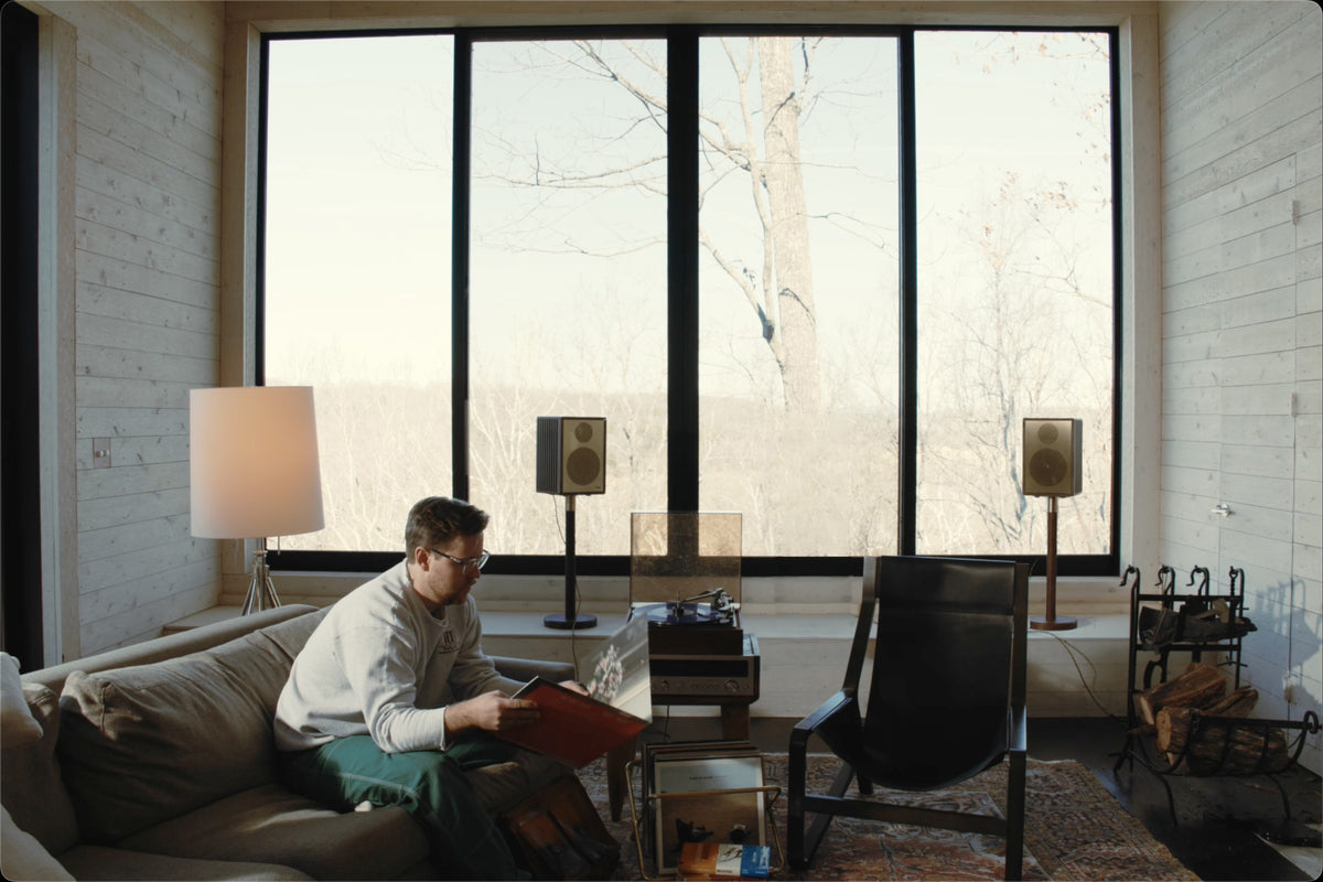 Listening to records at home with Sieg S14 speakers on stands by the window