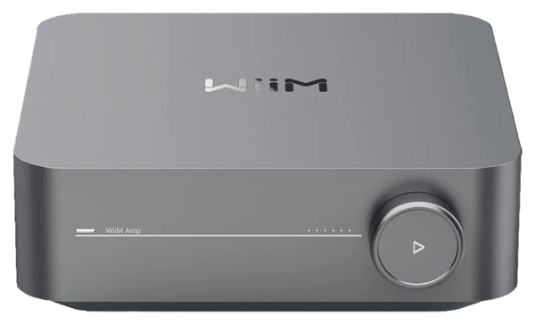 A WiiM Amp — the small streaming amplifier that sits between a phone and a pair of speakers